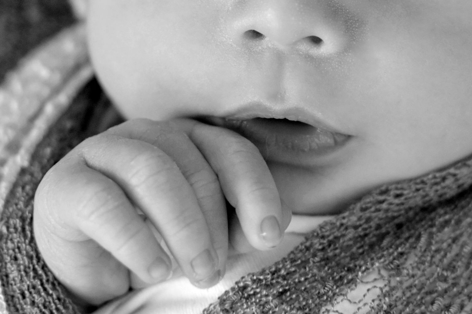 Intimate black and white close-up portrait of sleeping infant. San Antonio newborn photography