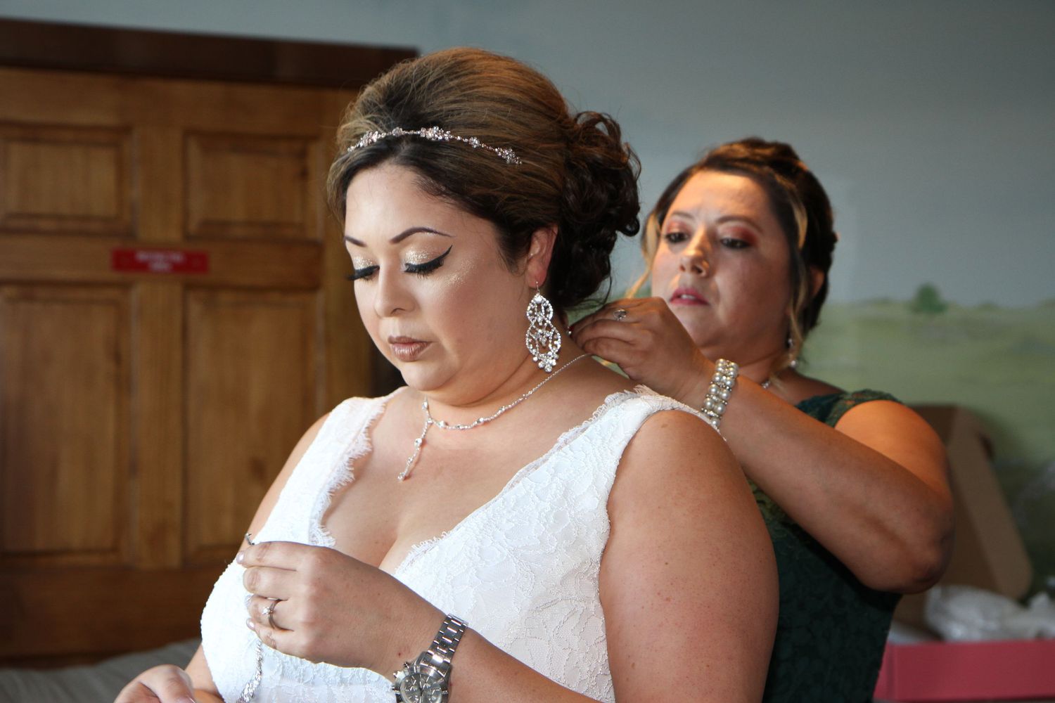 Emotional wedding preparation moments captured in getting ready room. San Antonio wedding photography