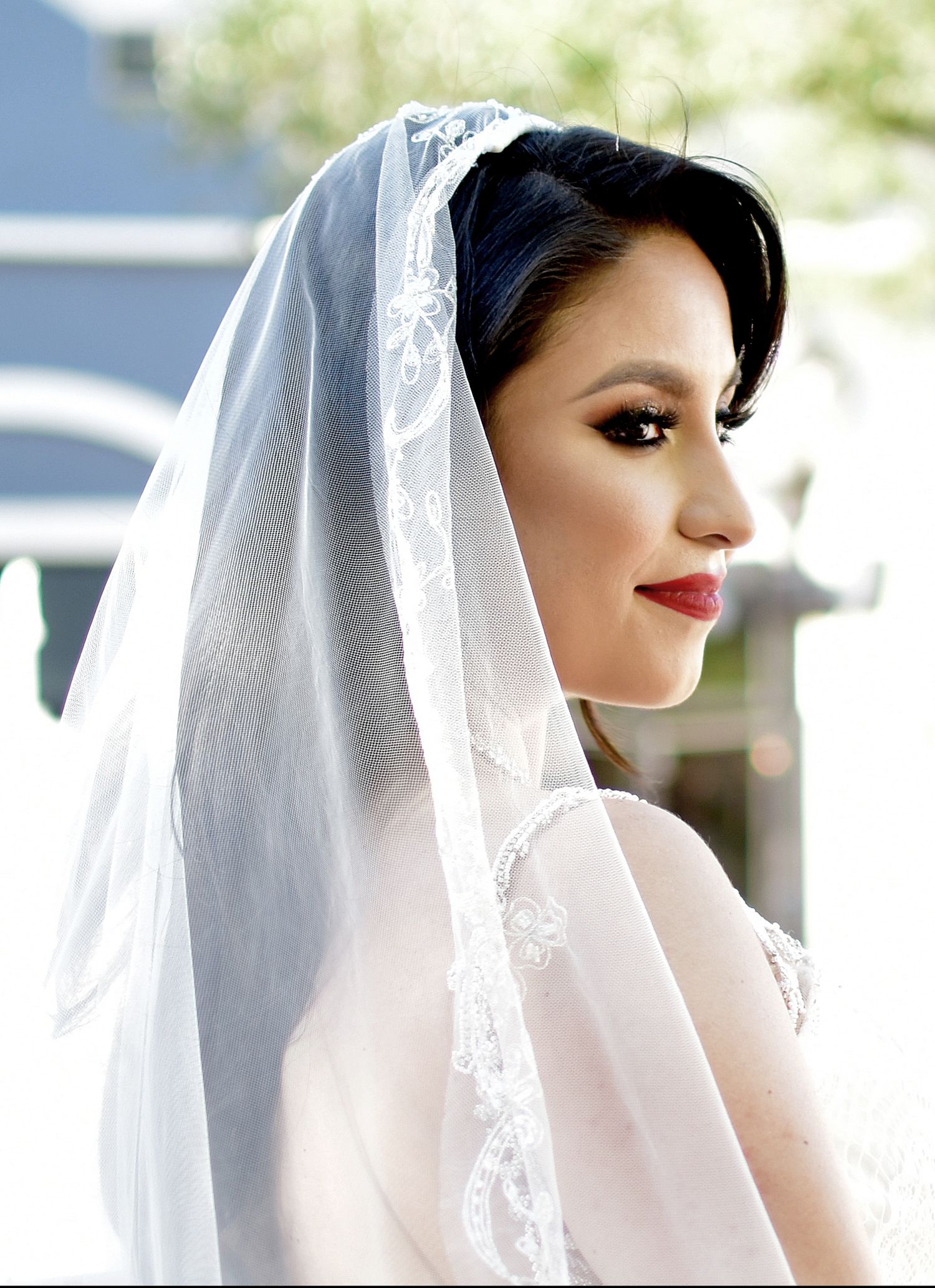 Artistic bridal portrait series featuring elegant veil and vintage-inspired makeup. San Antonio wedding photography