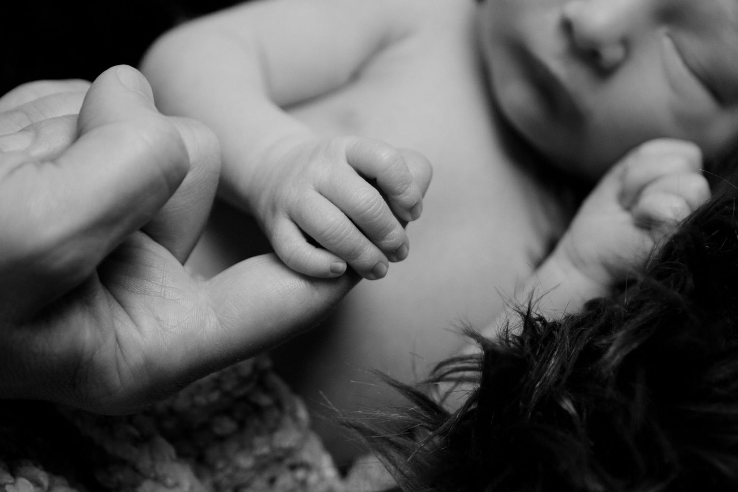 Artistic black and white close-up of sleeping newborn details. San Antonio newborn photography