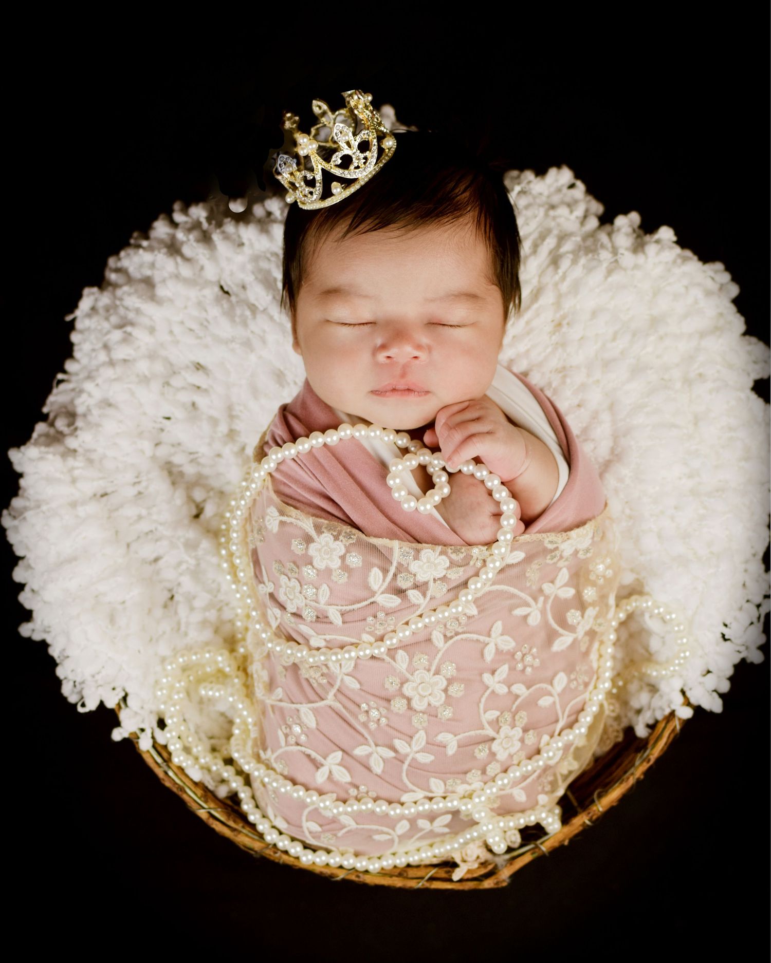 Newborn sleeping in vintage lace wrap on cream textured background. San Antonio newborn photography