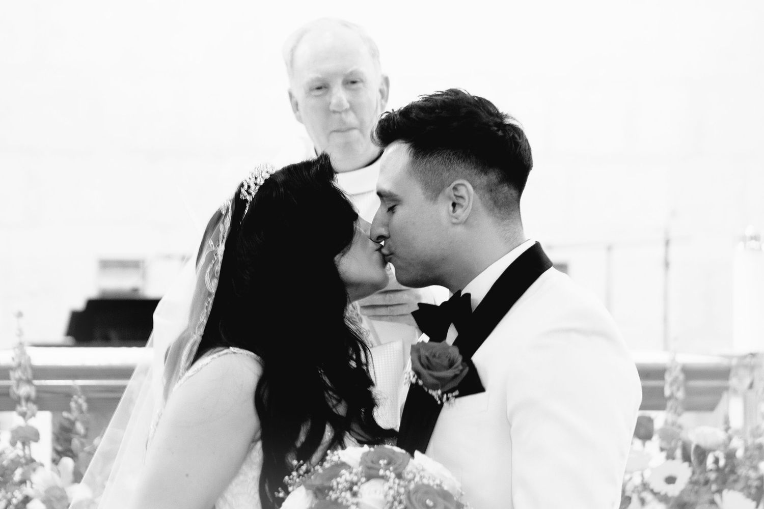 Black and white photo of couple during the end of the wedding ceremony. San Antonio wedding photography and Texas area