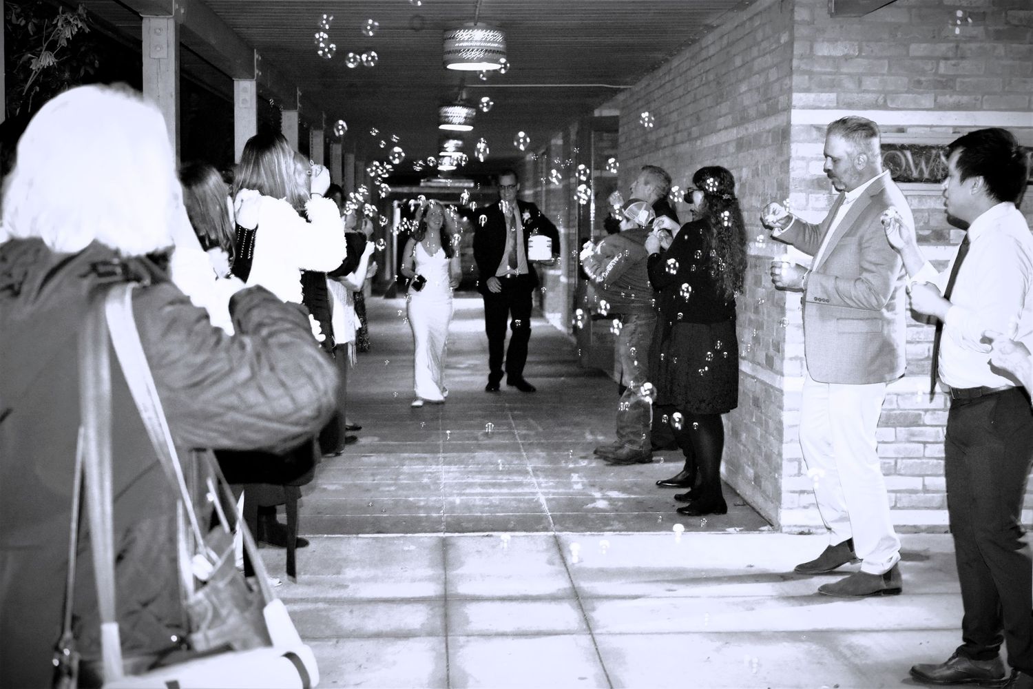 Black and white wedding reception photos showing guests enjoying themselves, San Antonio wedding photography