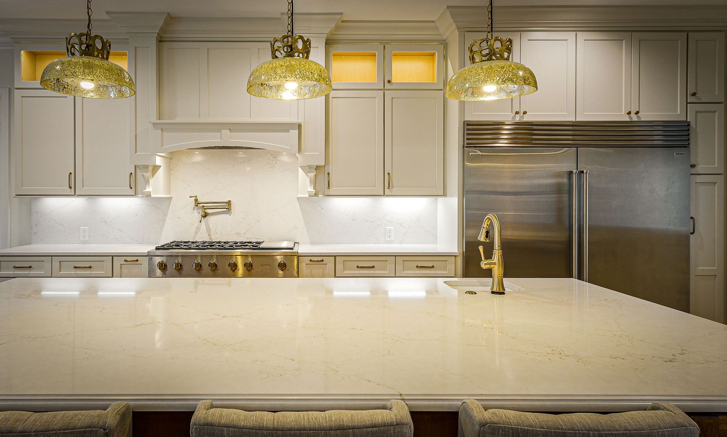 High-end residential interior captured with luxury real estate photography and natural light. Beautiful new construction kitchen ideas.
