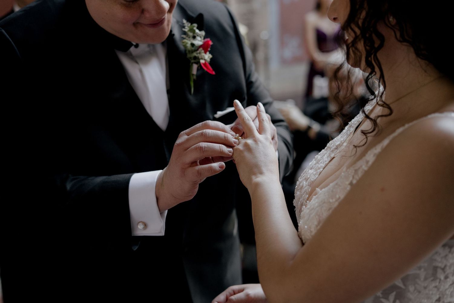 Close-up details of wedding ceremony moments in dramatic lighting.