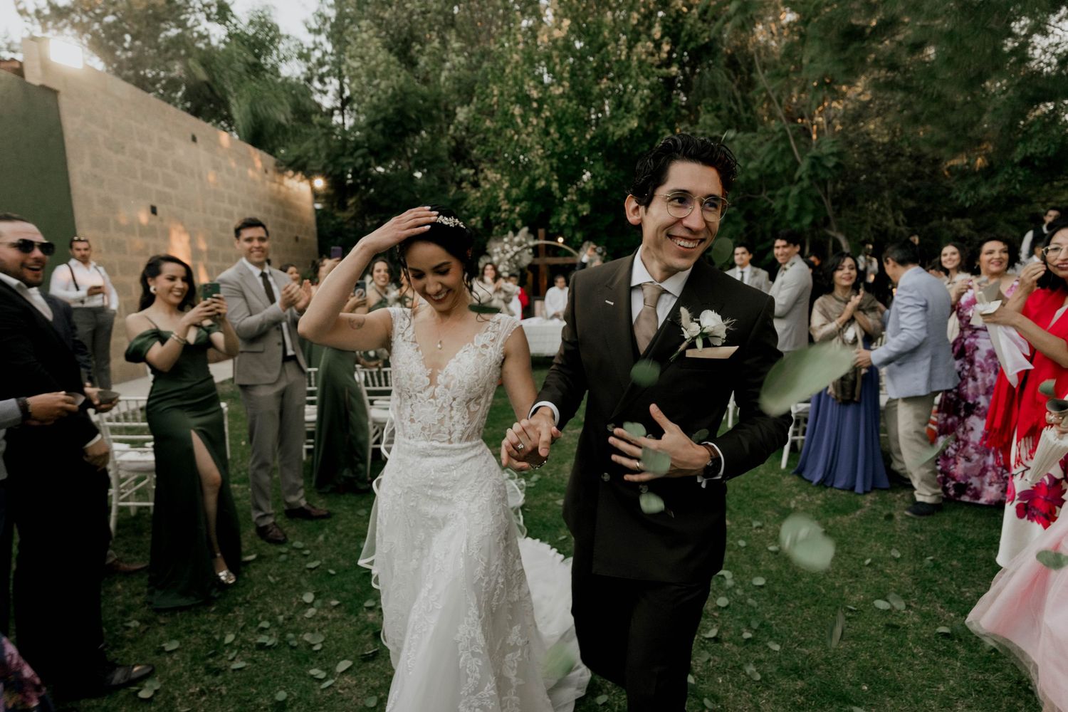 Joyful wedding celebration moments captured in an outdoor garden setting.
