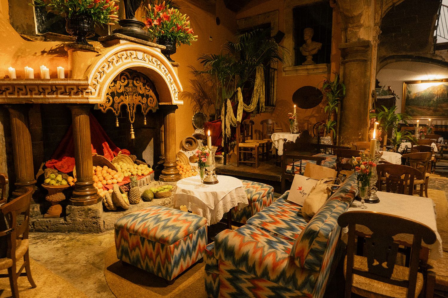 Rustic Spanish restaurant interior with stone walls and traditional decor lit by warm ambient lighting.