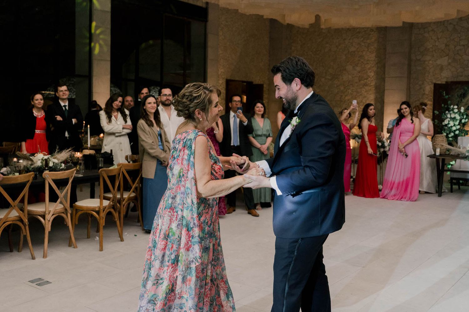 Wedding reception dance sequence showing couple twirling on dance floor.