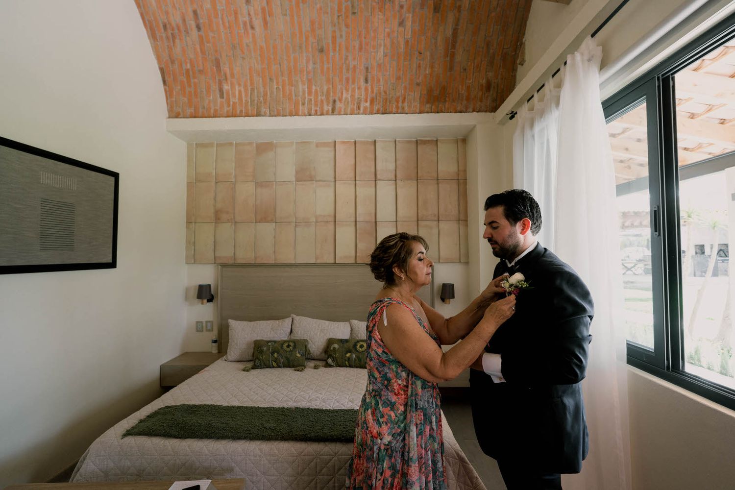 Candid moments captured in a modern interior space with brick walls and large windows.