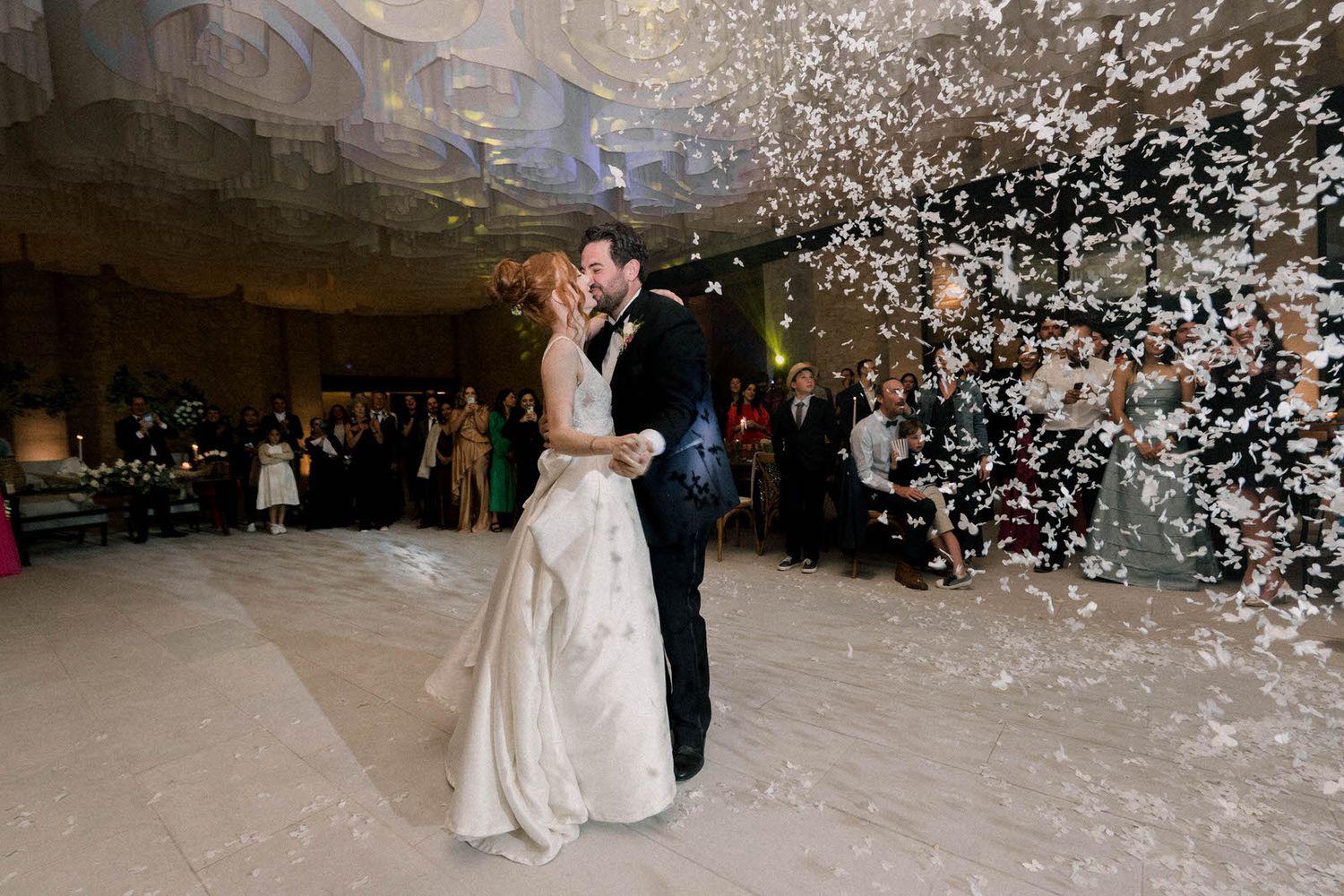 A magical moment captured as confetti rains down during a wedding first dance.