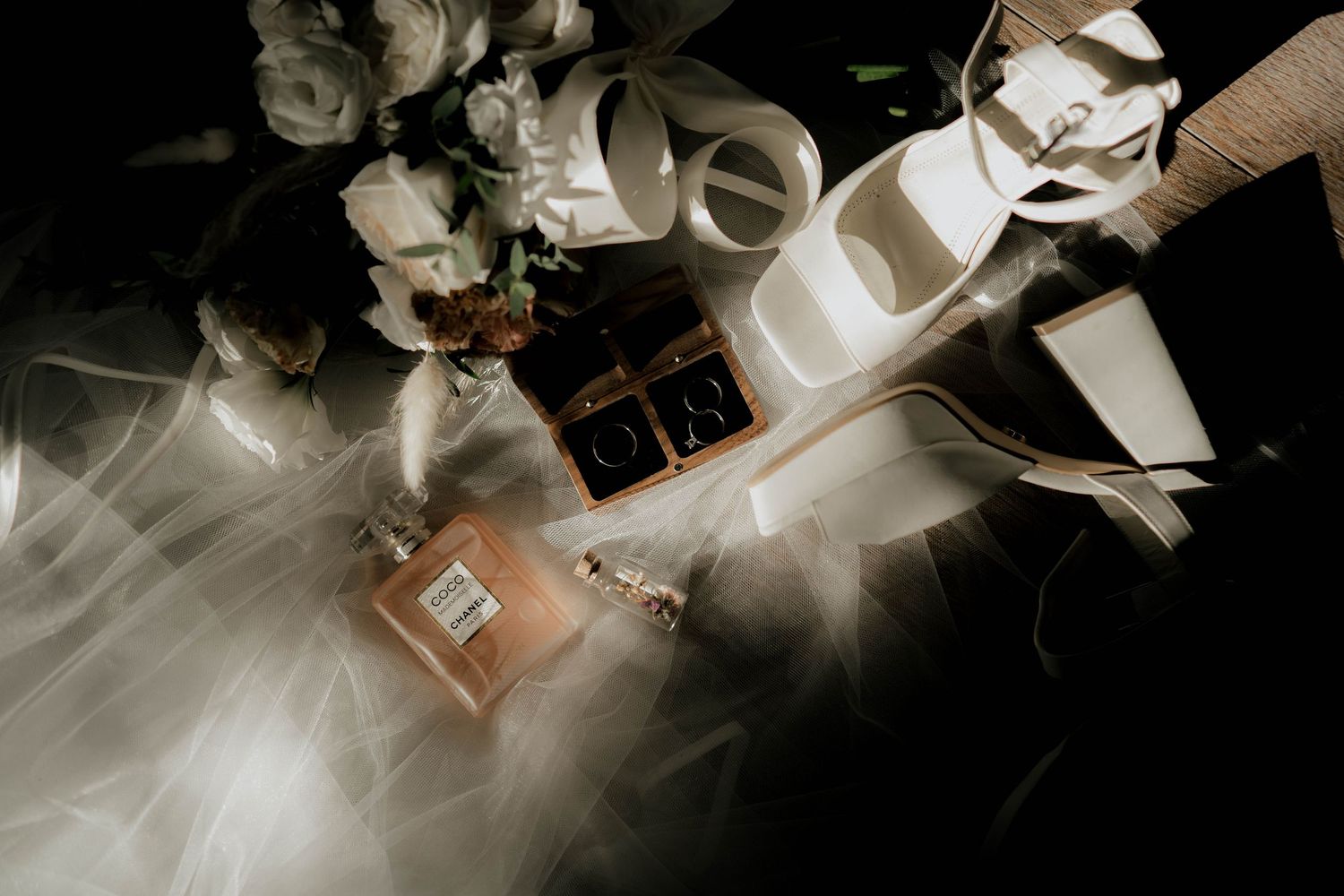 Artistic black and white composition of scattered papers and dramatic lighting.