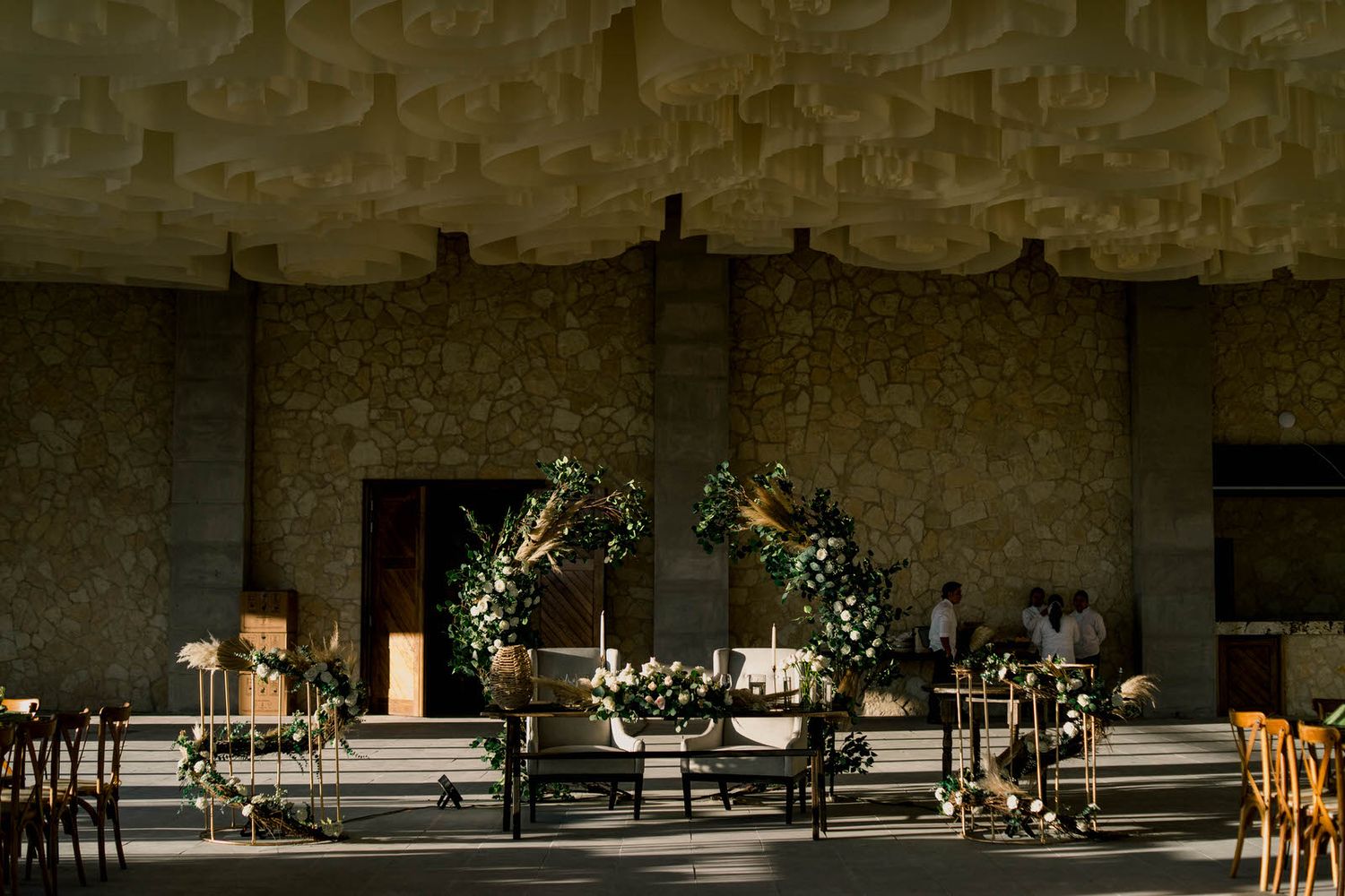 Industrial event venue with minimalist decor and natural lighting.