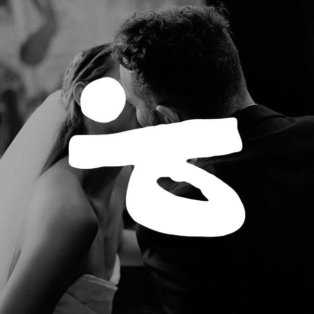 Intimate black and white dance moment at a wedding reception.