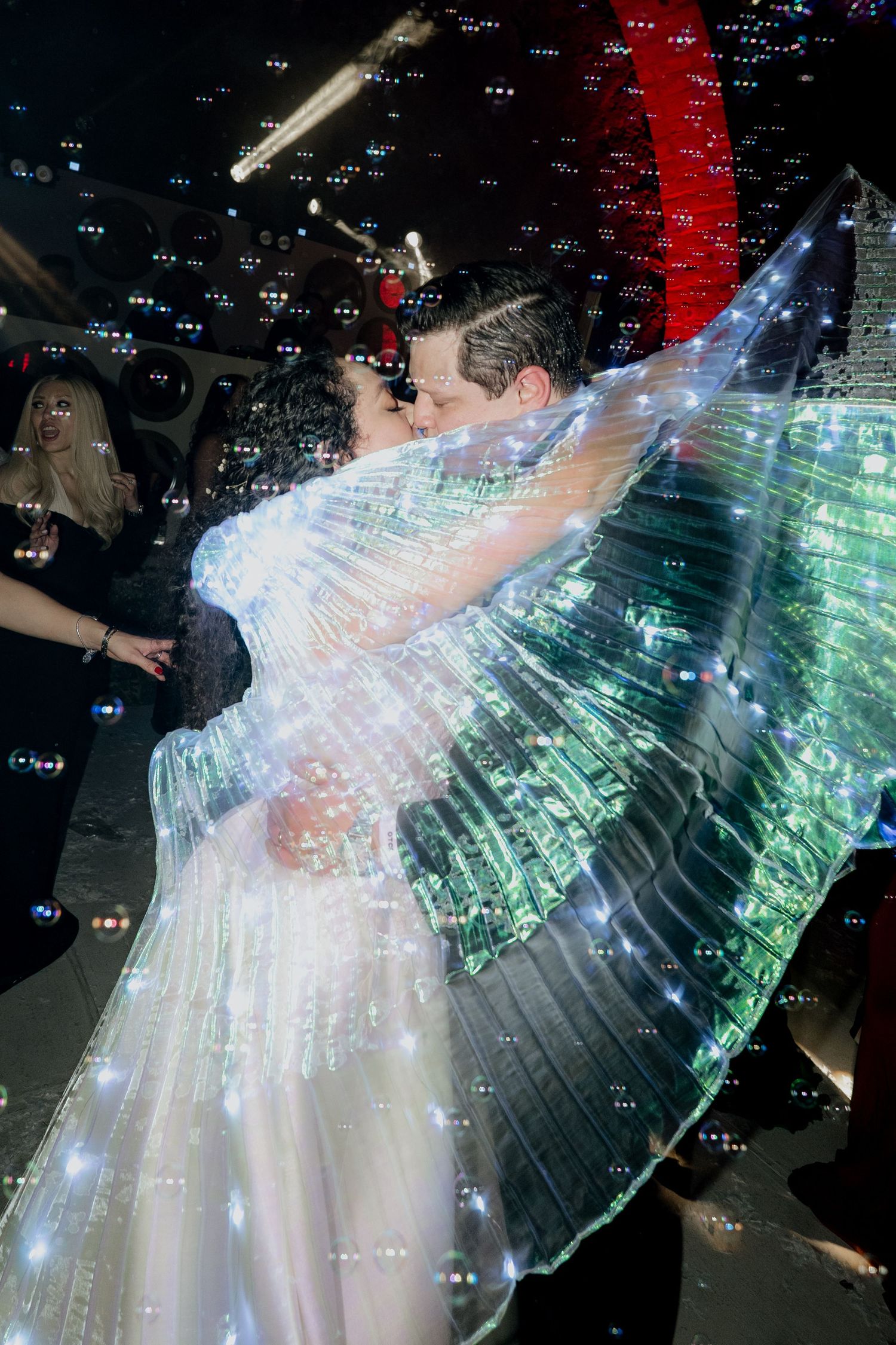 Ethereal wedding dress with fiber optic lighting creates a stunning light show on the dance floor.