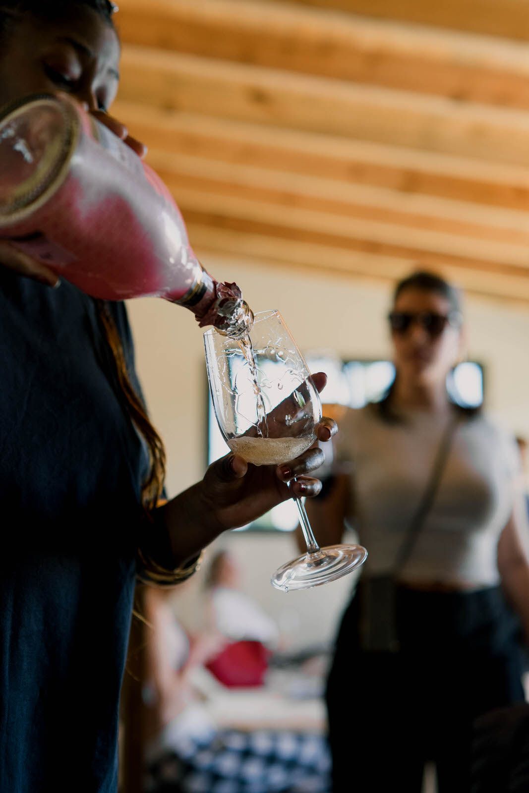 Close-up shots of champagne being poured into glasses during a celebration.
