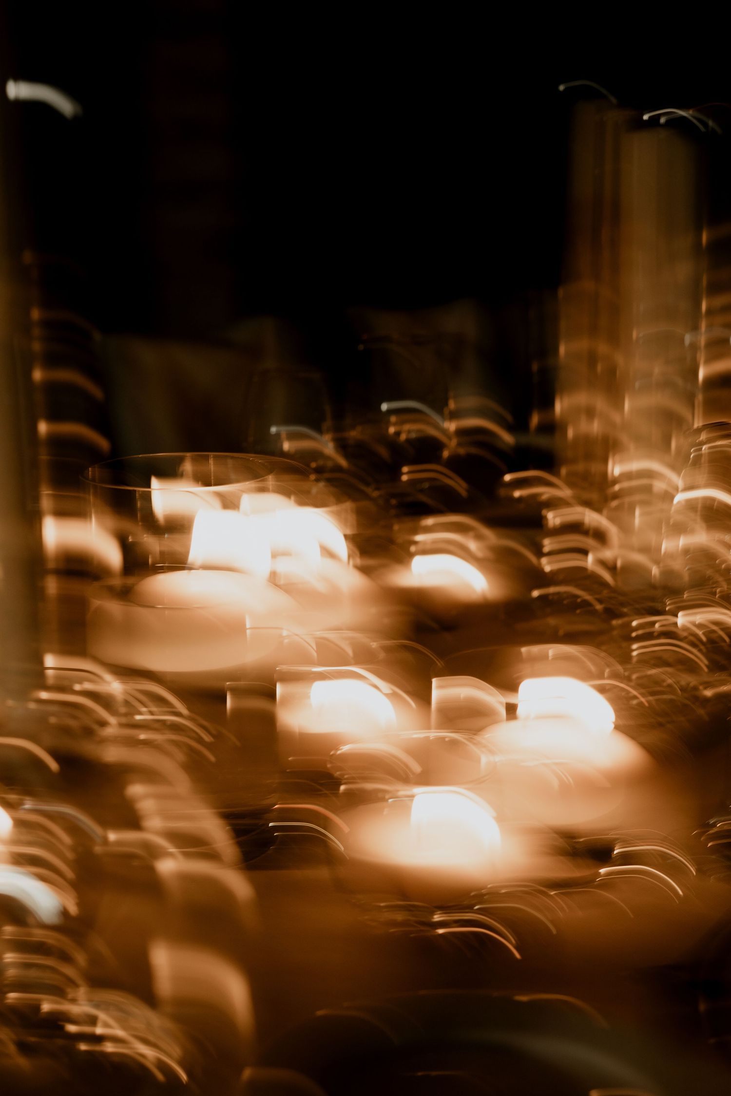 Abstract light bokeh pattern creating a warm glowing effect in the darkness.