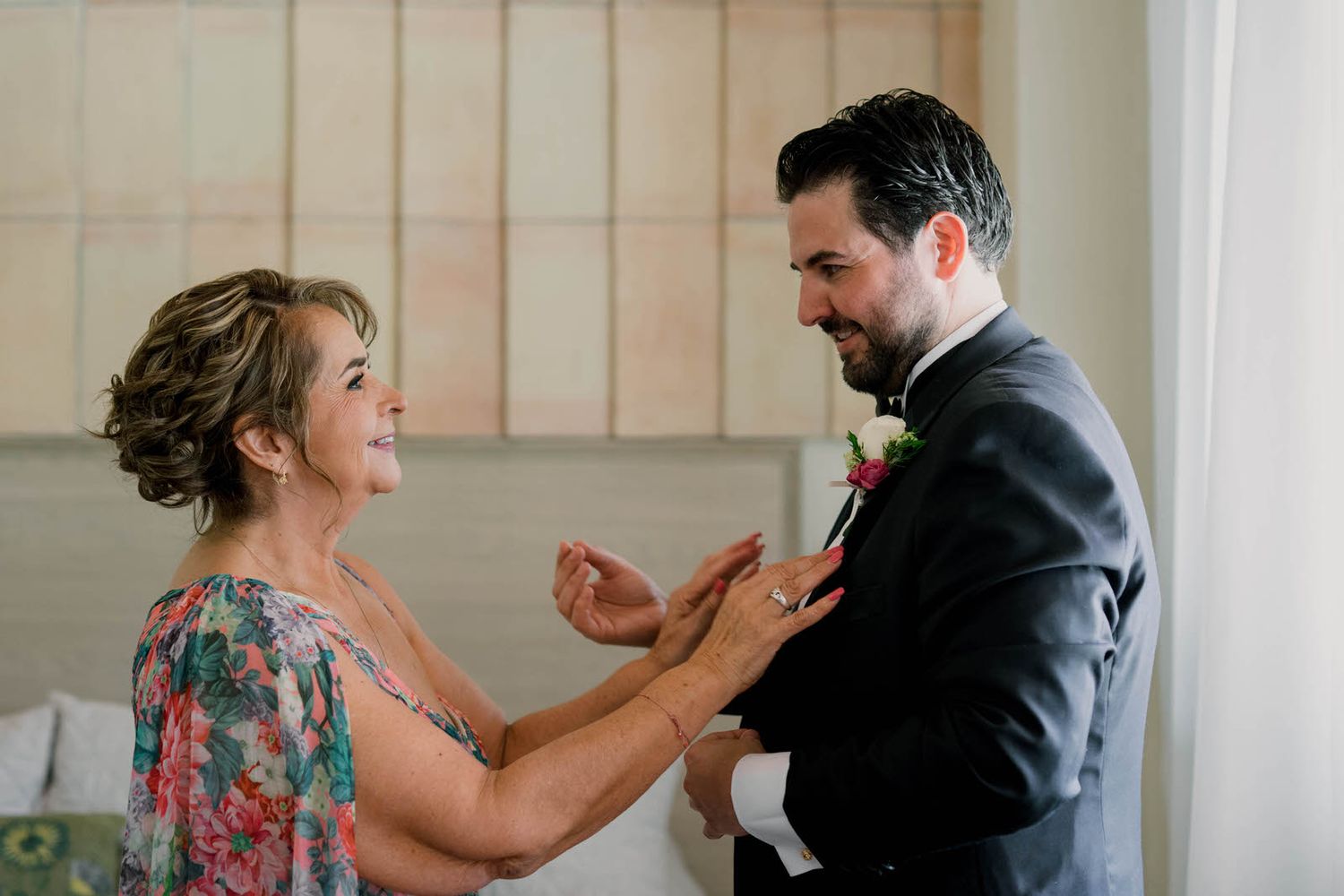 Two people sharing an emotional moment in a bright, modern interior setting.