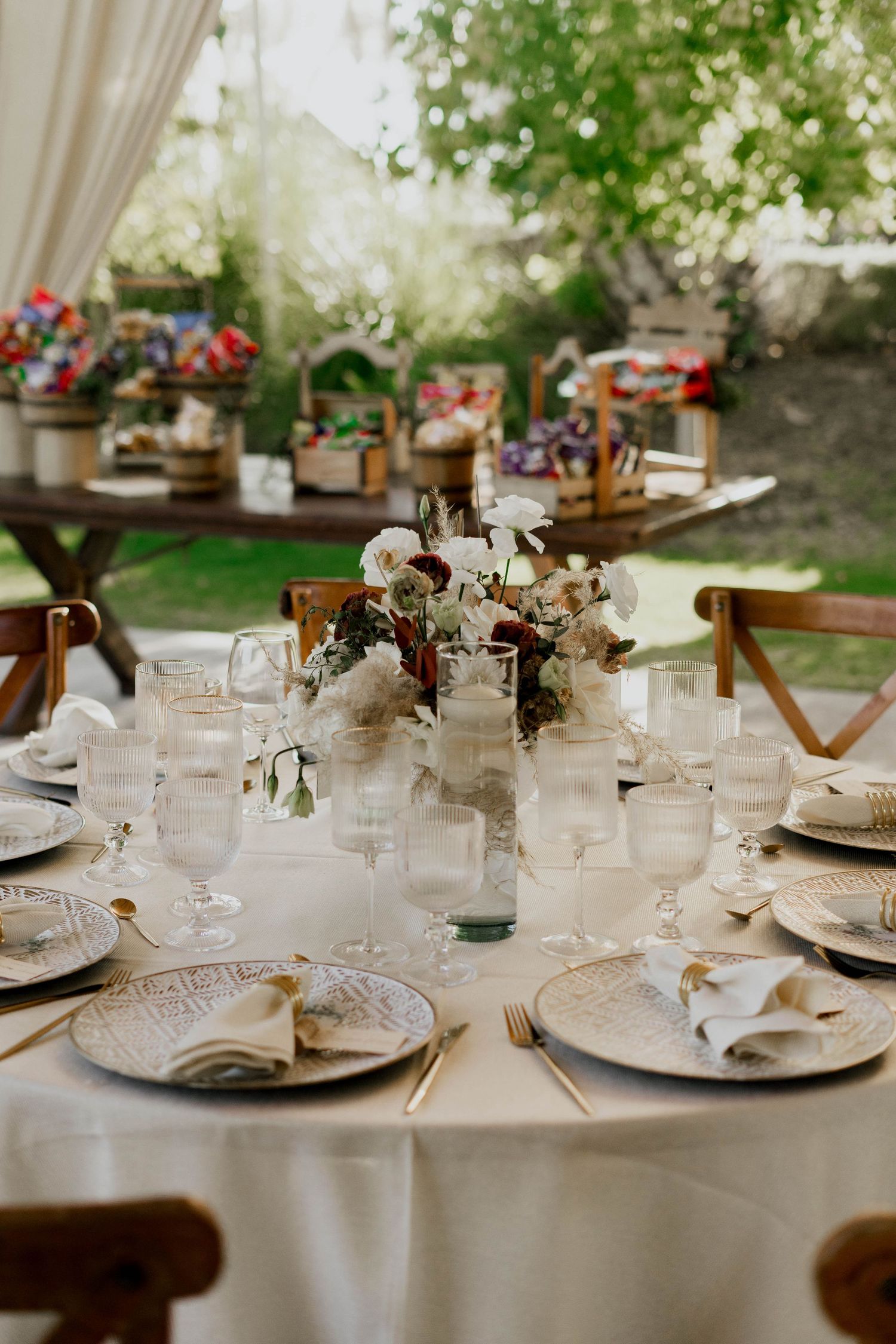 Elegant wedding table settings with crystal glassware and delicate floral centerpieces.