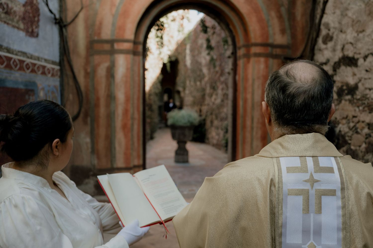 Wedding ceremony procession in a traditional church setting.