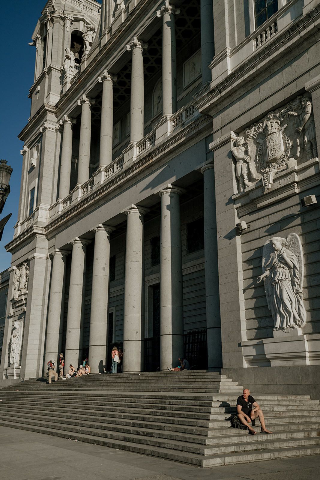 A sequence of five architectural photos showing ornate stone steps and columns of a classical building facade.