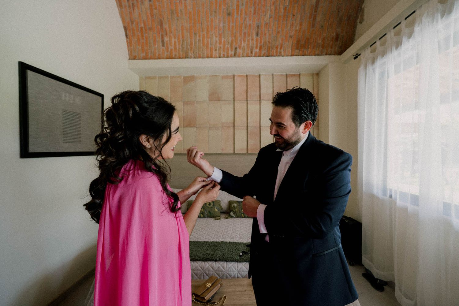 A series of intimate moments captured in a bright interior space with warm brick walls and natural lighting.