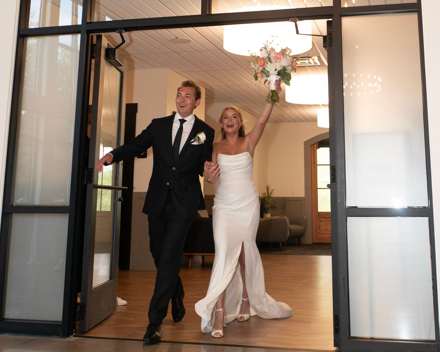 bride and groom entrance to reception photo