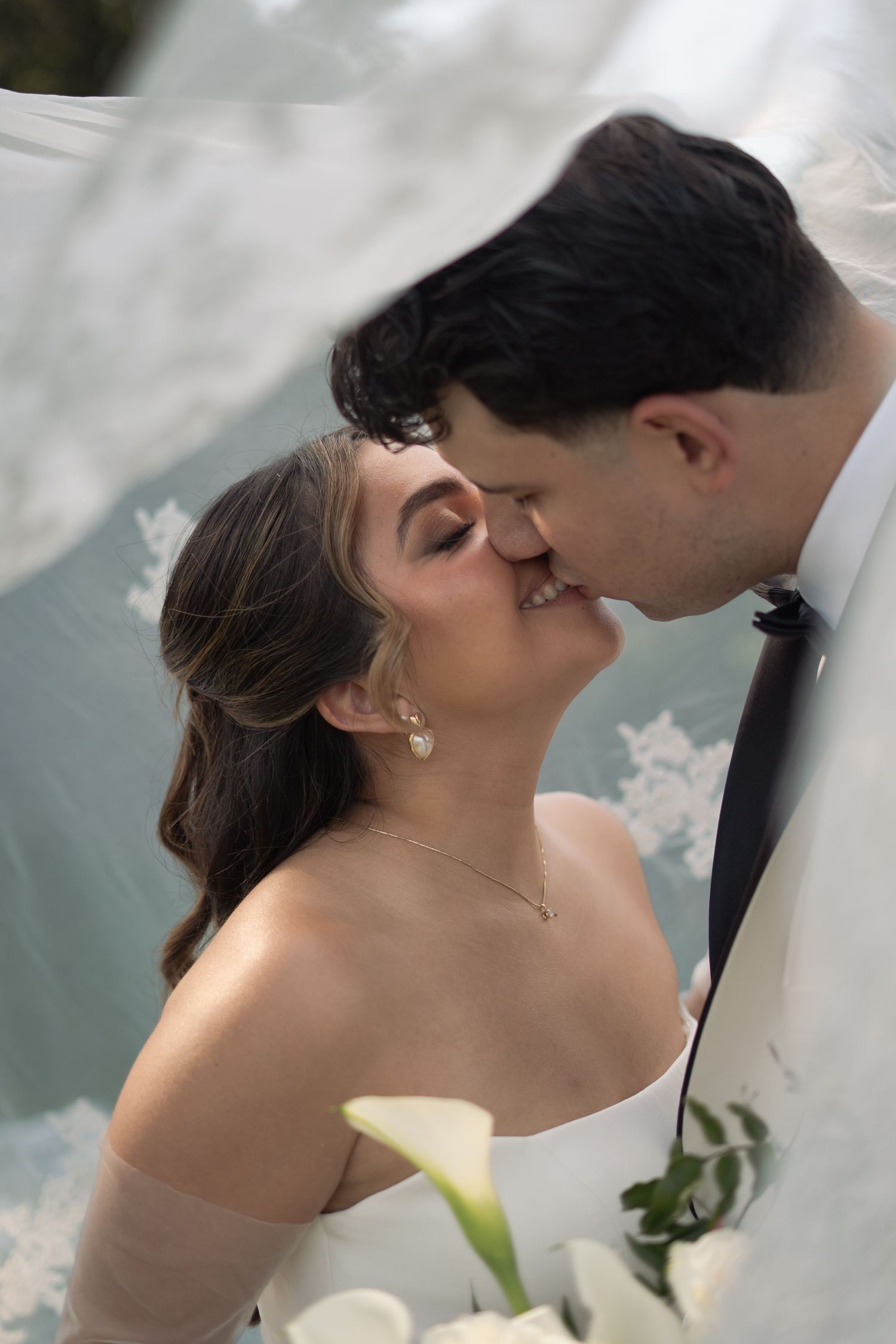 bride and groom kiss