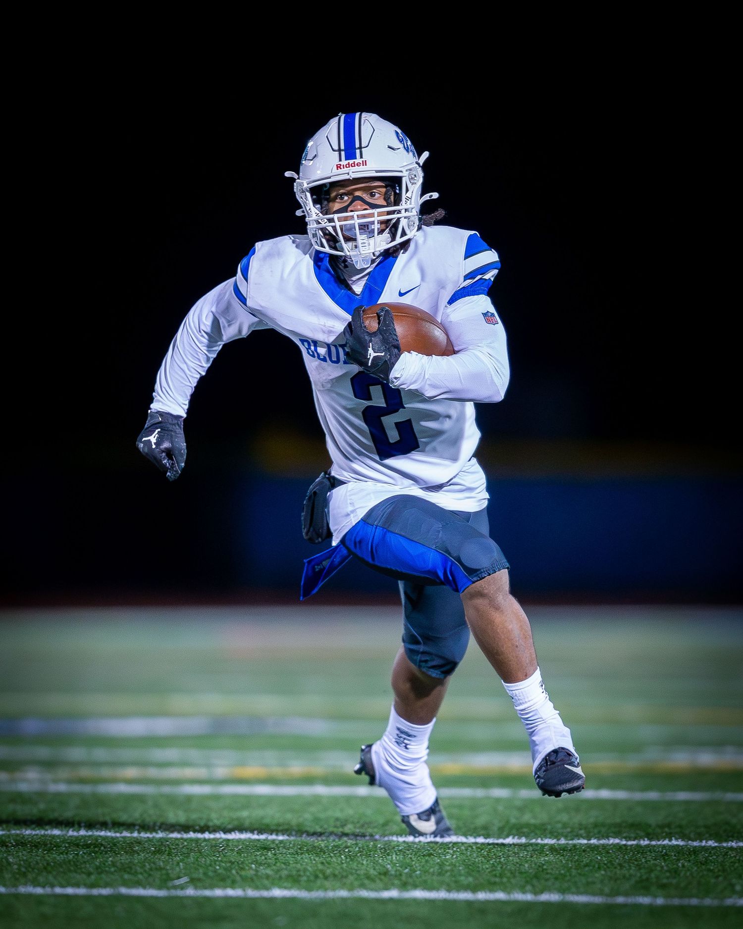 Ewing High School varsity football player running the ball in Mercer County, New Jersey.