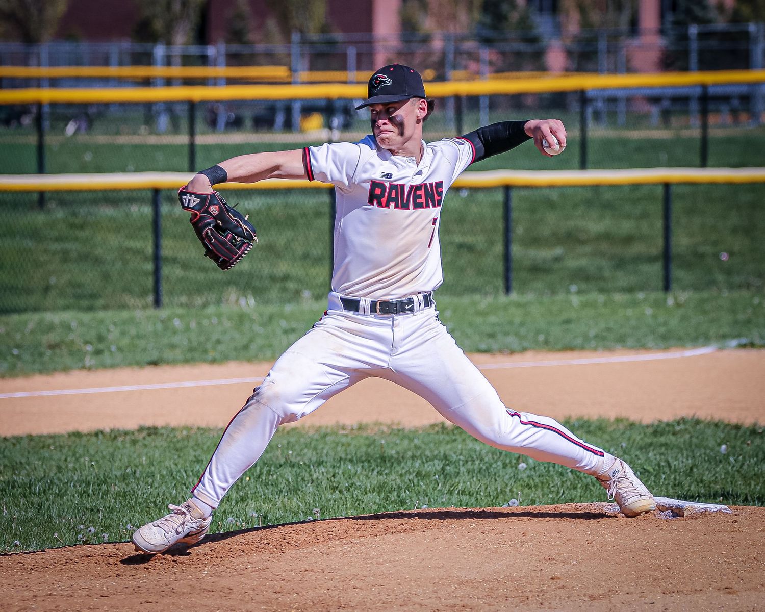 Robbinsville varsity baseball pitcher pitching the ball in Mercer County, New Jersey.