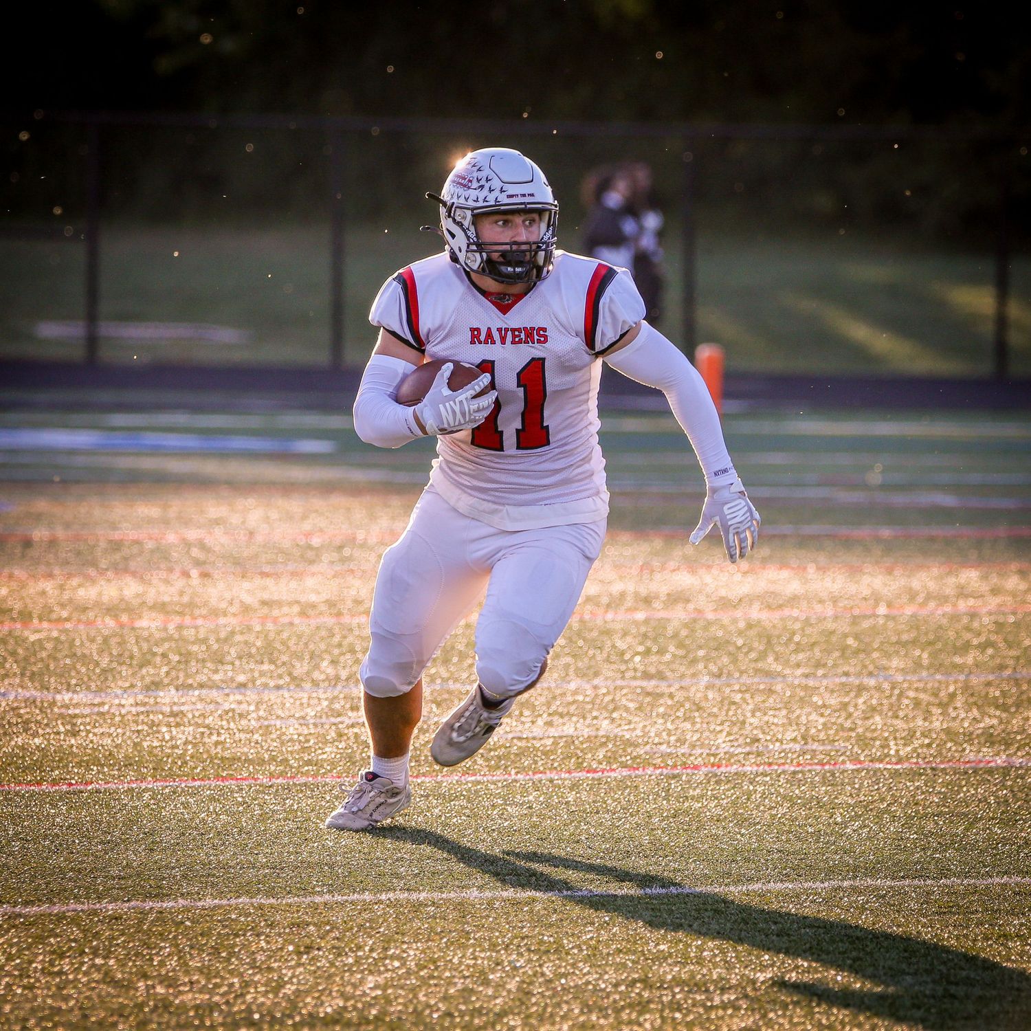 Robbinsville High School varsity football athelete running the ball in Mercer County, New Jersey.