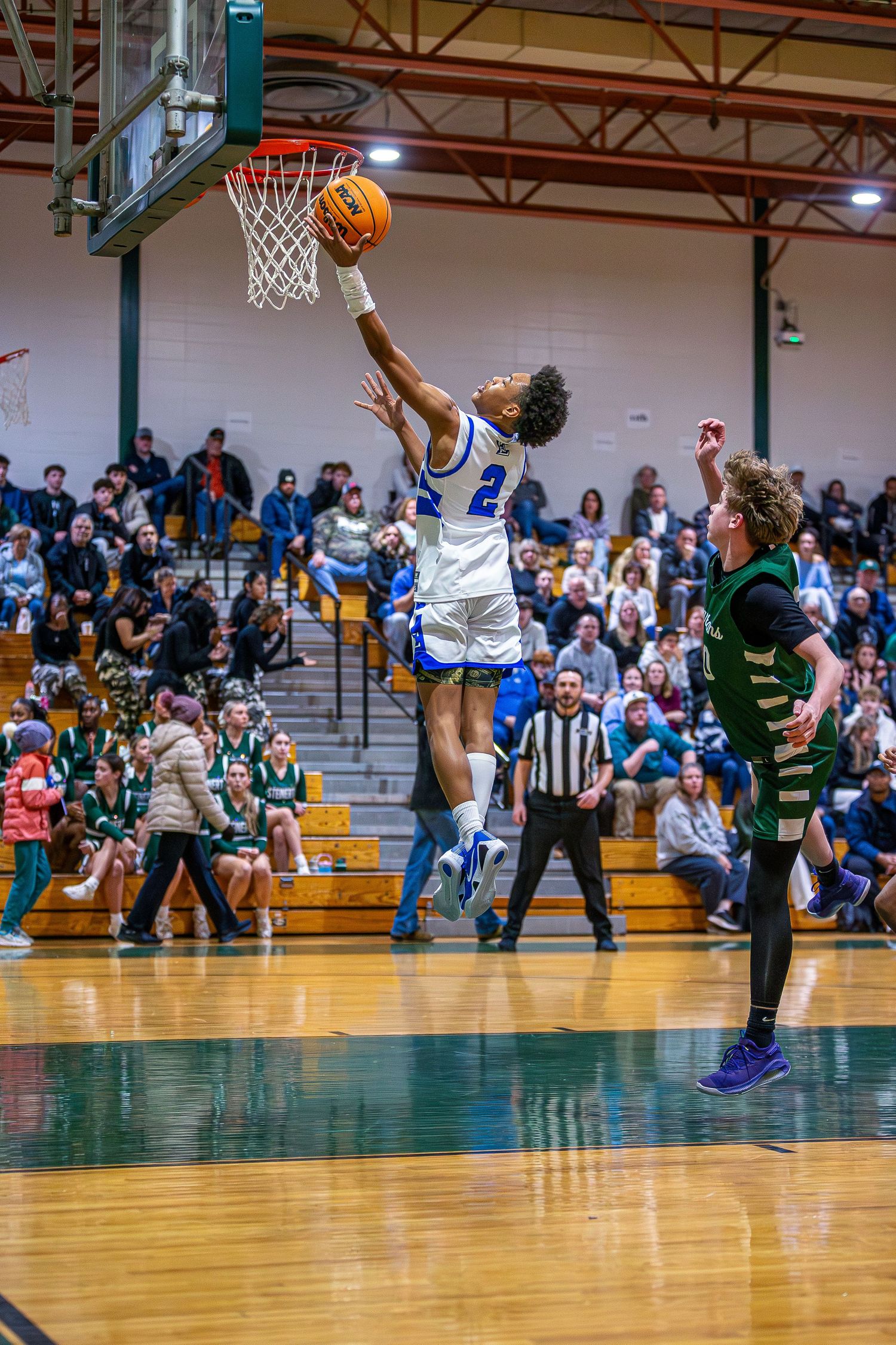 Ewing High School boys varsity basketball player laying up the ball in Mercer County, New Jersey.