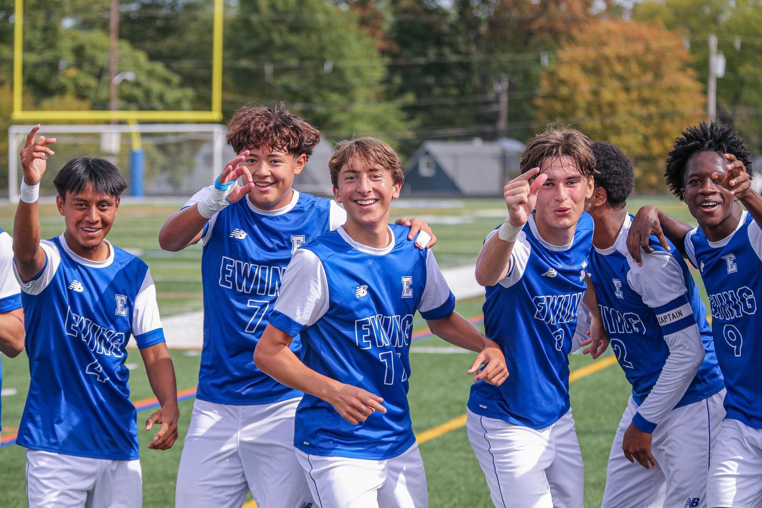 Ewing High School boys varsity soccer players celebrating a goal in Mercer County, New Jersey.