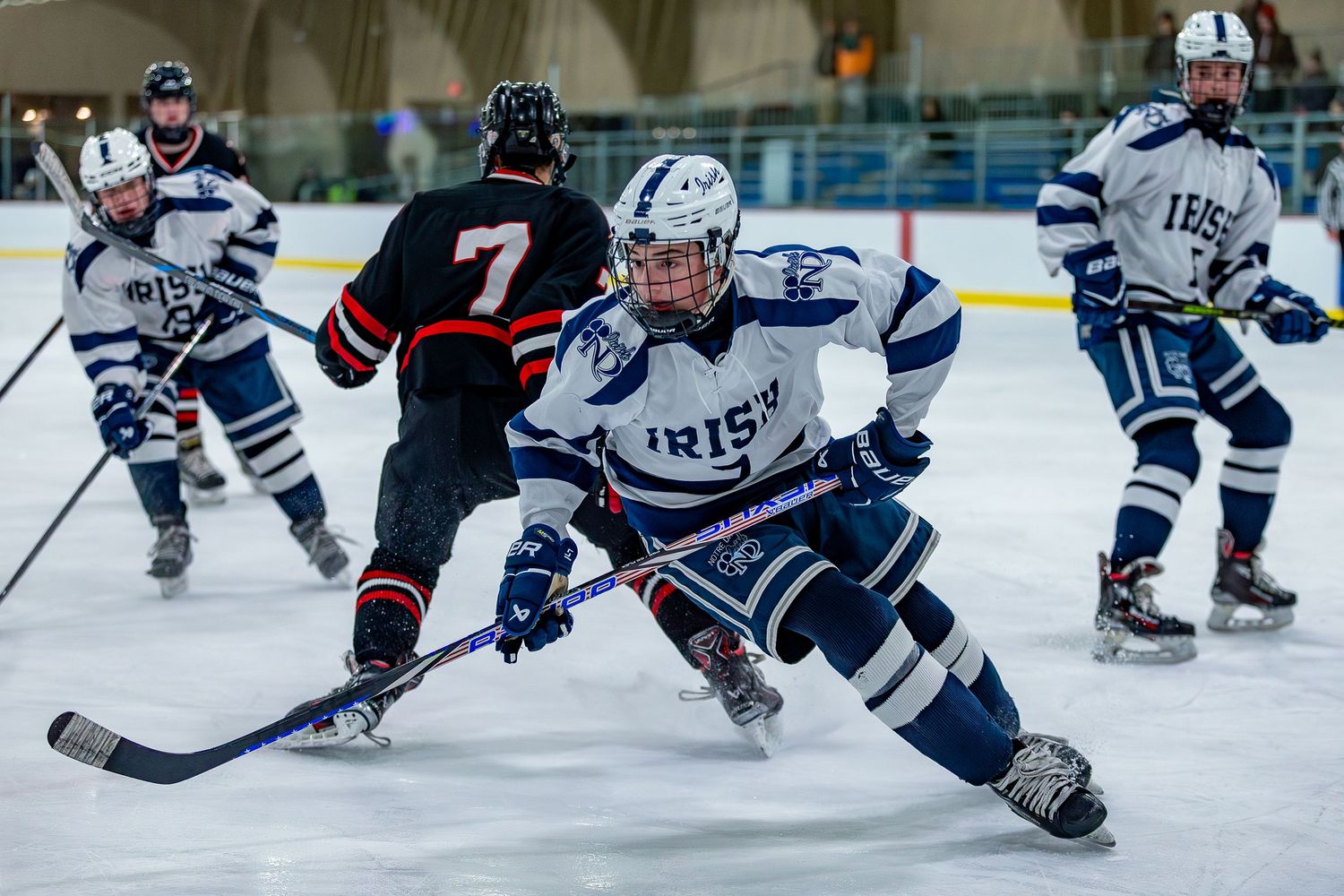 Notre Dame High School ice hockey player skating in game in Mercer County, New Jersey.
