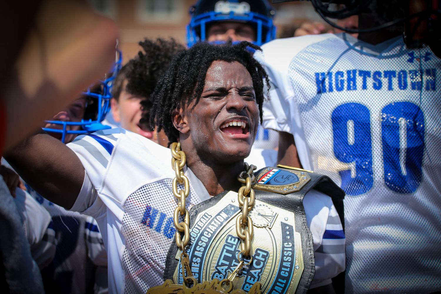 Hightstown High School varsity football player celebrating award at Battle at the Beach tournament in Ocean County, New Jersey.