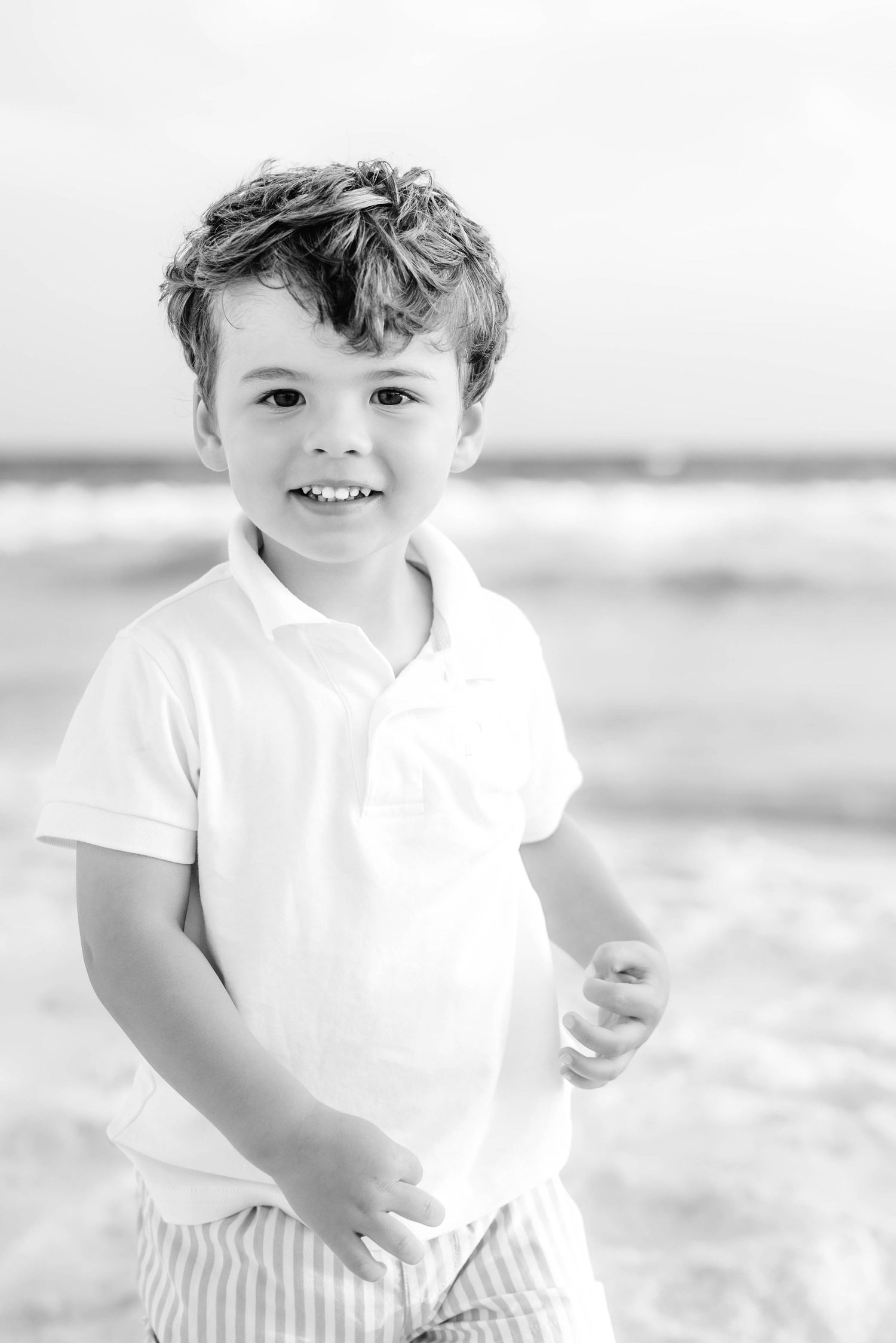Series of bright beachside portraits showing joyful expressions in white clothing.