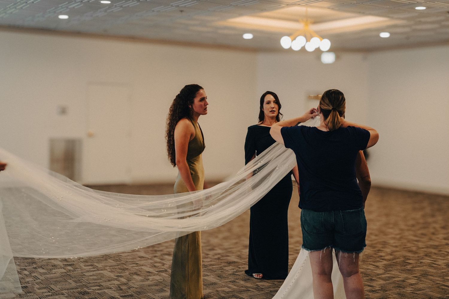 veil flows behind bride