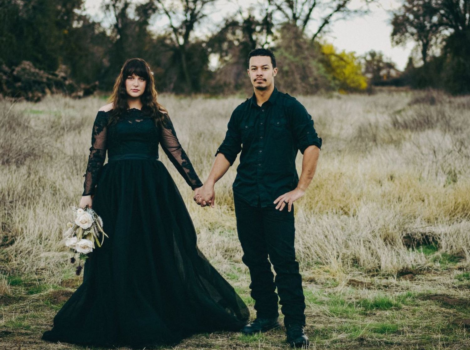 Exeter couple poses in black wedding dress