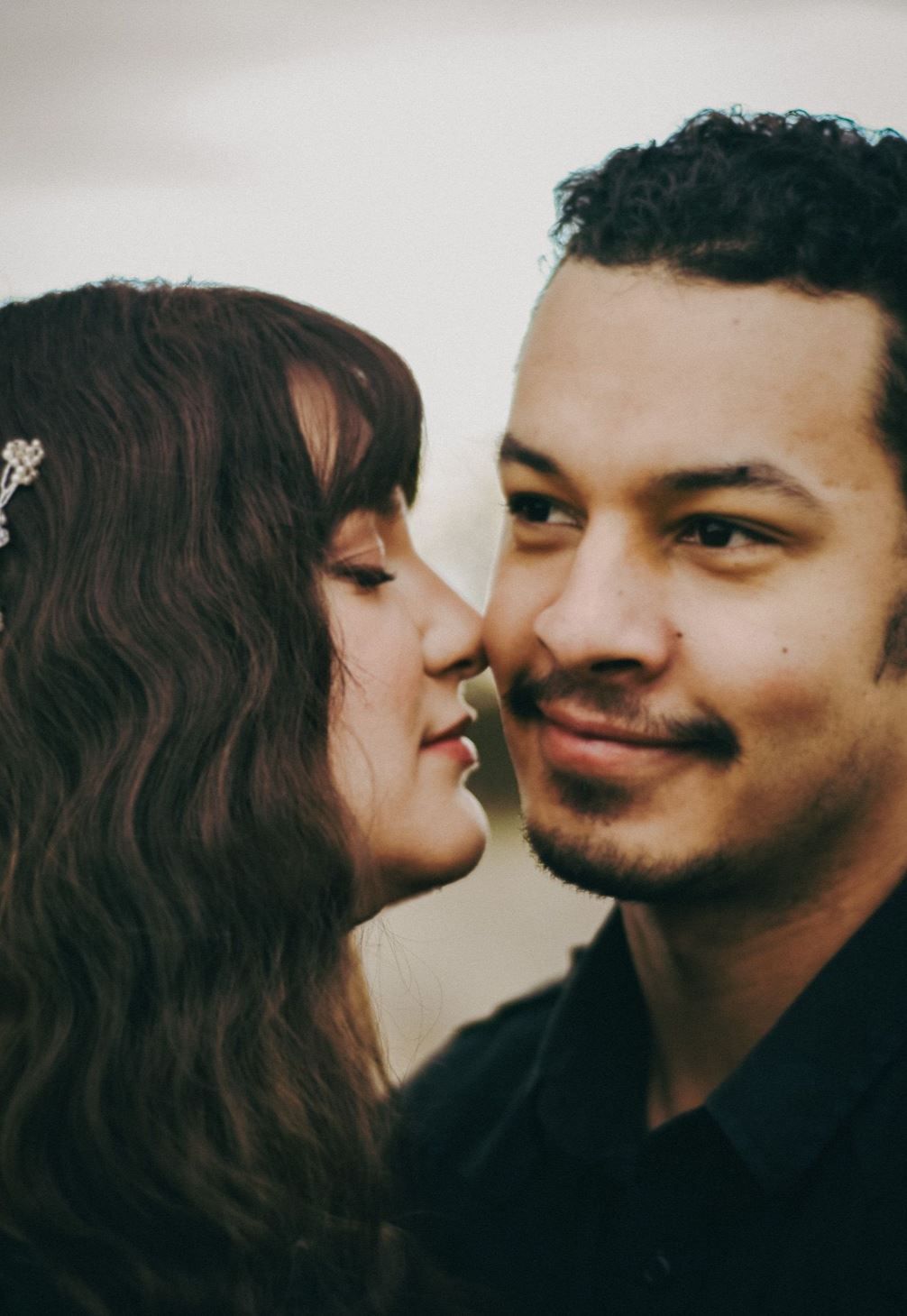 Exeter couple poses in black wedding dress close up