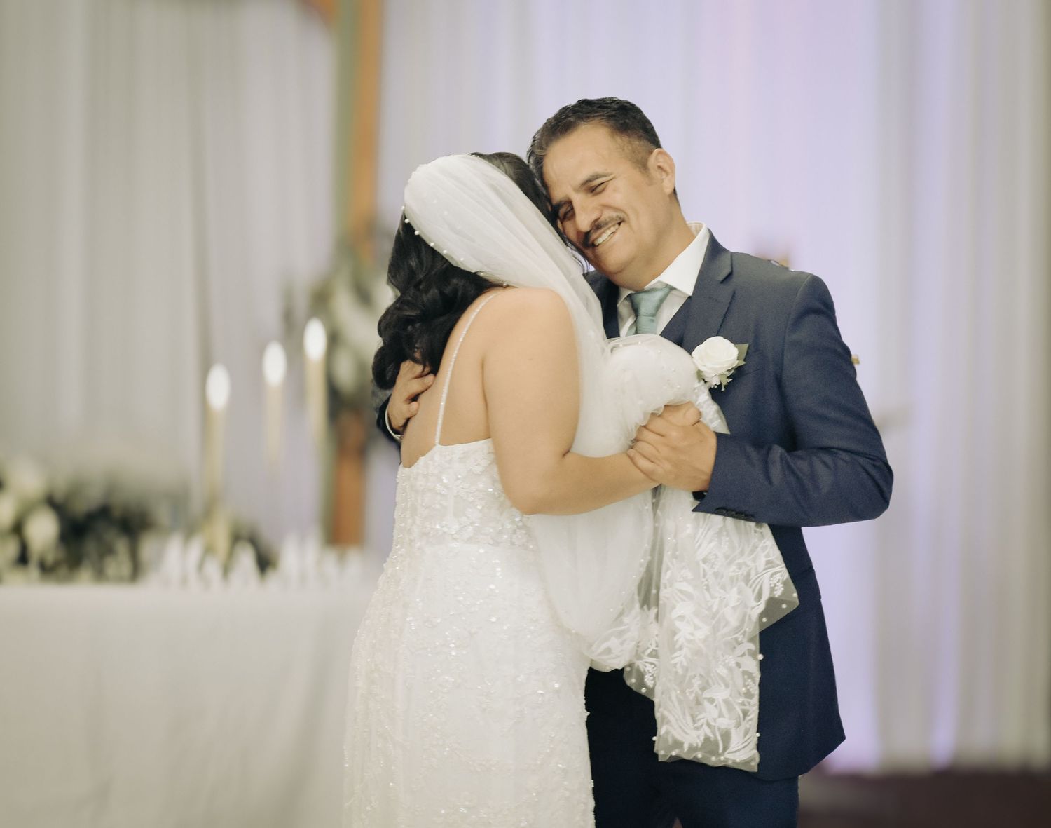 bride and father embrace