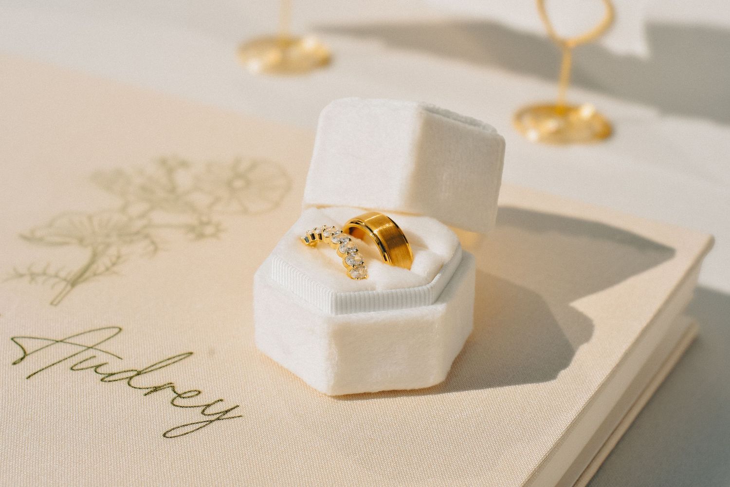 A wedding at The Hyde in Visalia features a ring box and ring set