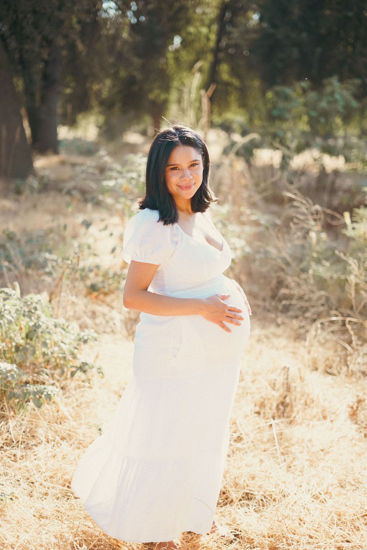 Maternity picture of woman in Exeter field cinematic