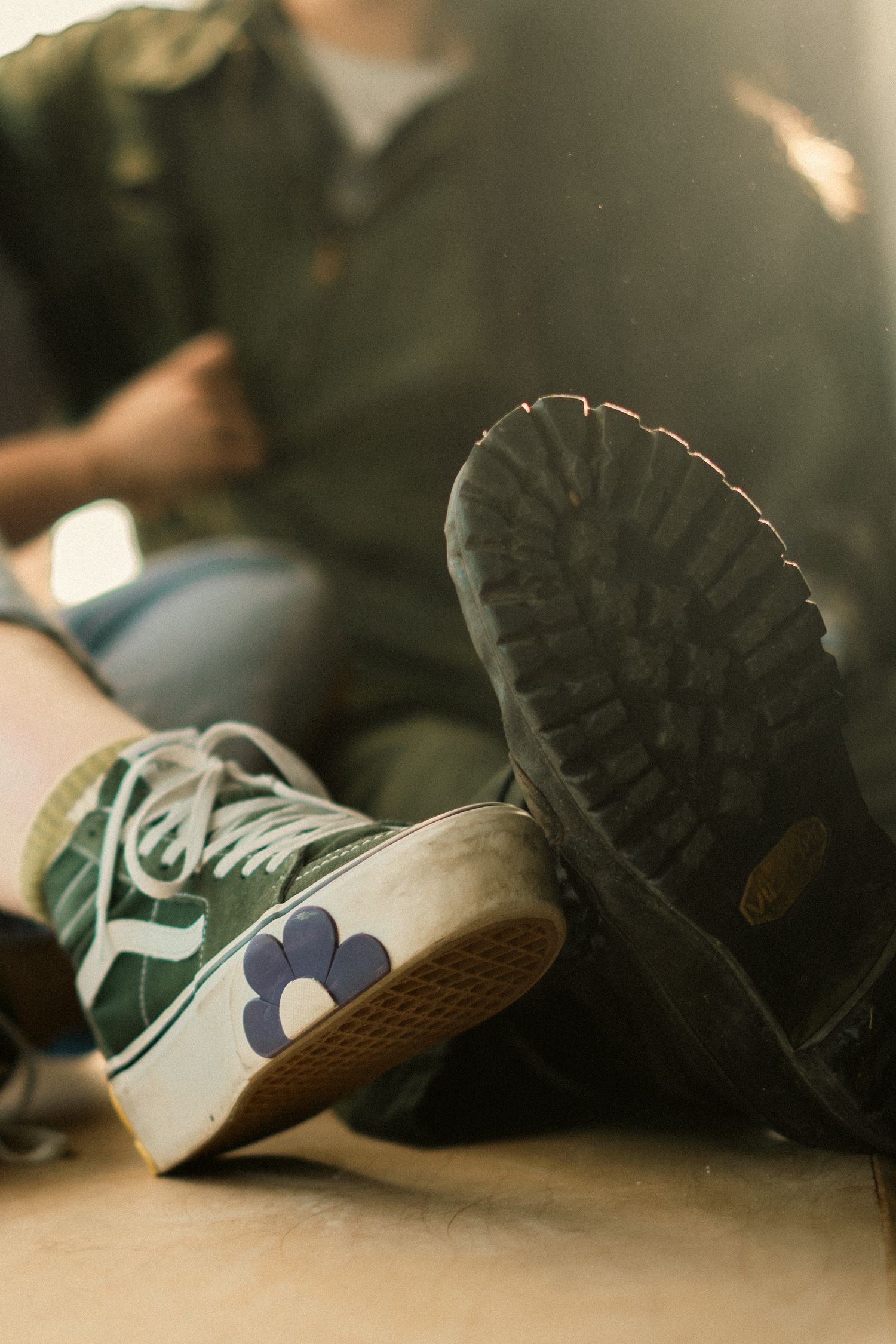 An engaged couple rub toes in Bakersfield Ca