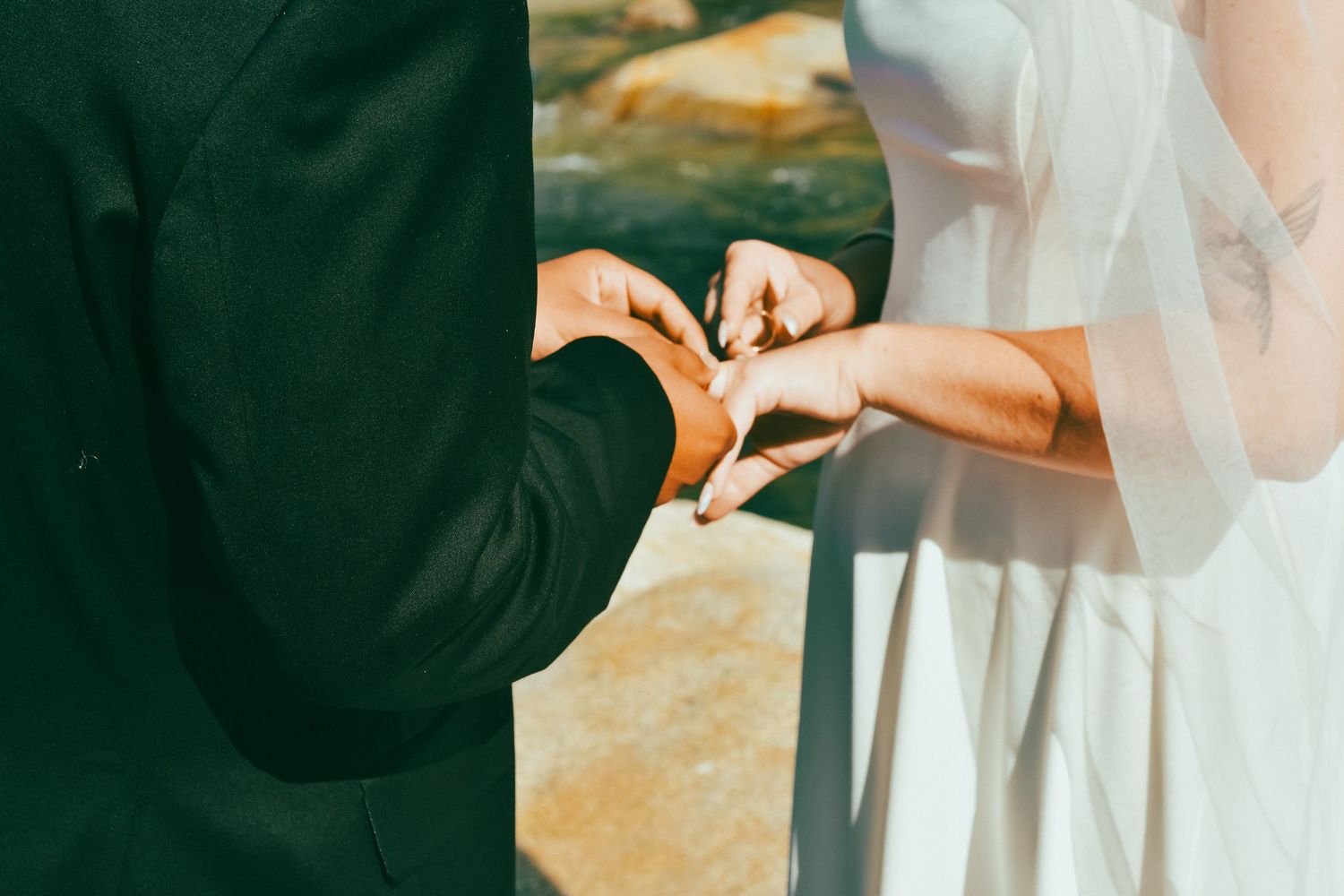 A couple exchange wedding rings in Sequoia California