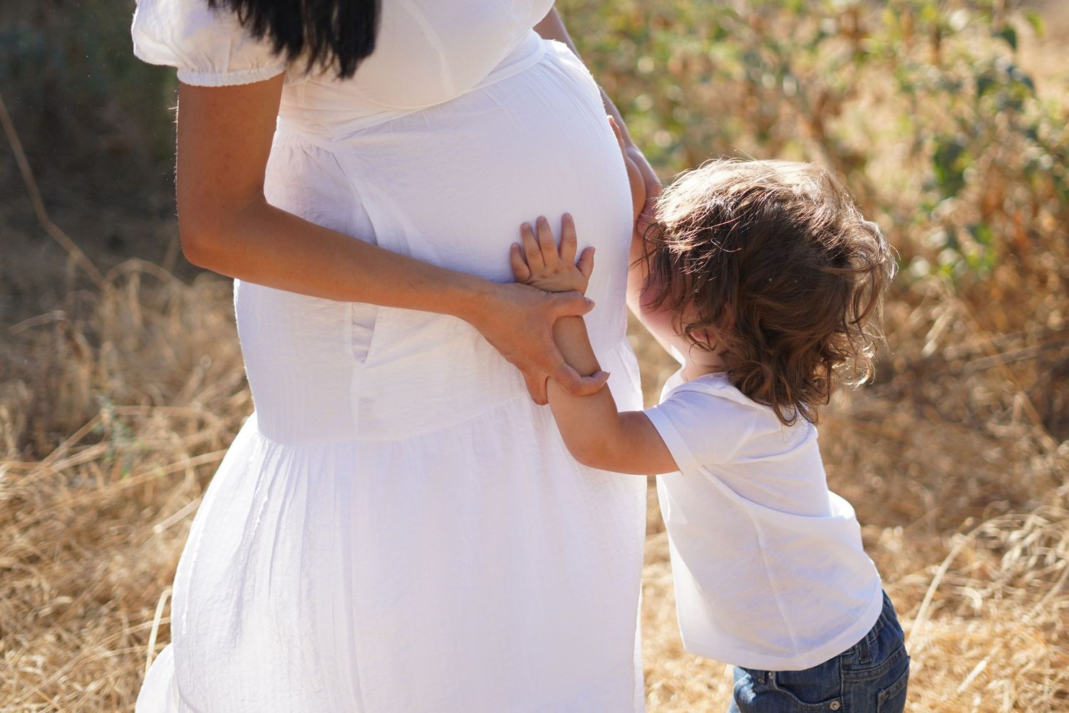 Maternity picture of woman in Exeter field cinematic