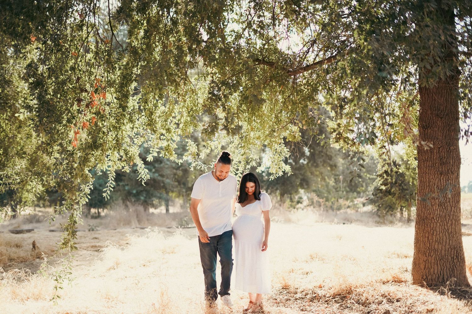 Maternity picture of woman and husband in Exeter field cinematic