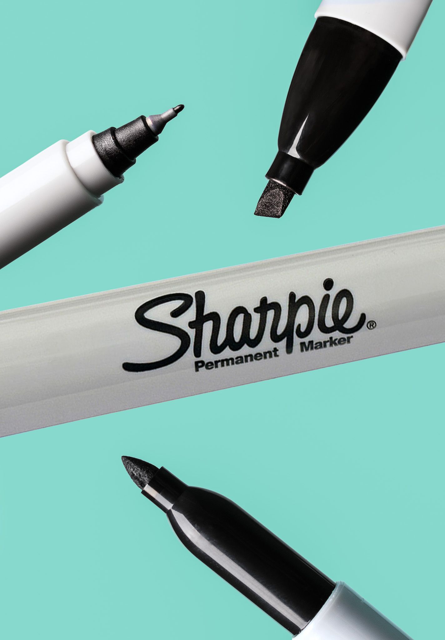 Three Sharpie permanent markers displayed on teal background showing fine point and chisel tips.