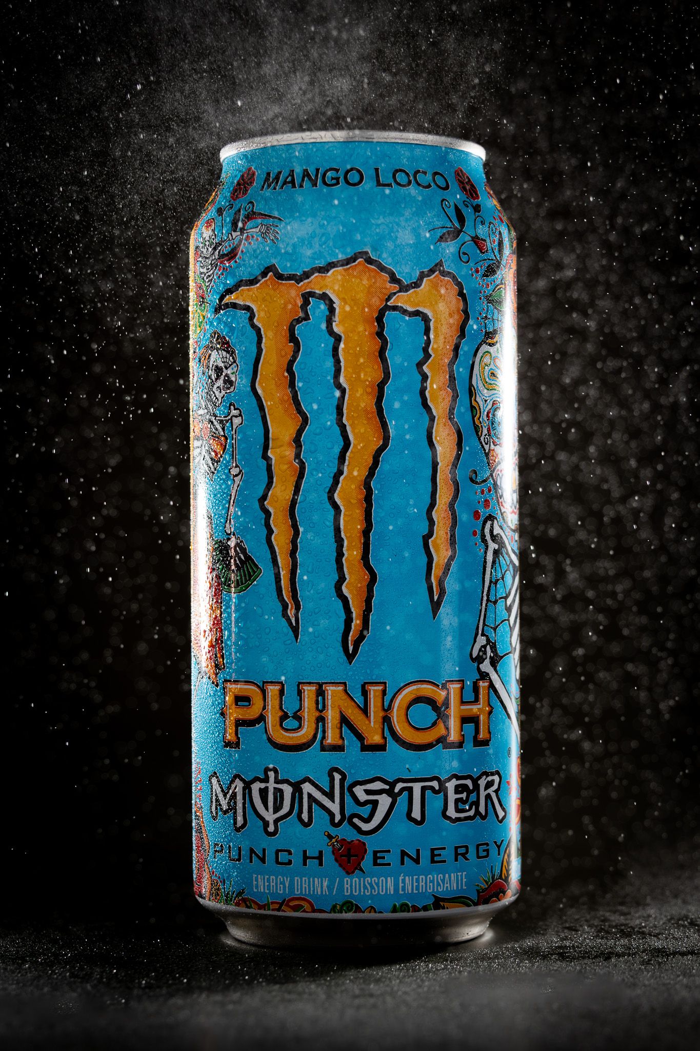 Monster Punch Mango Loco energy drink can with water droplets on dark background.