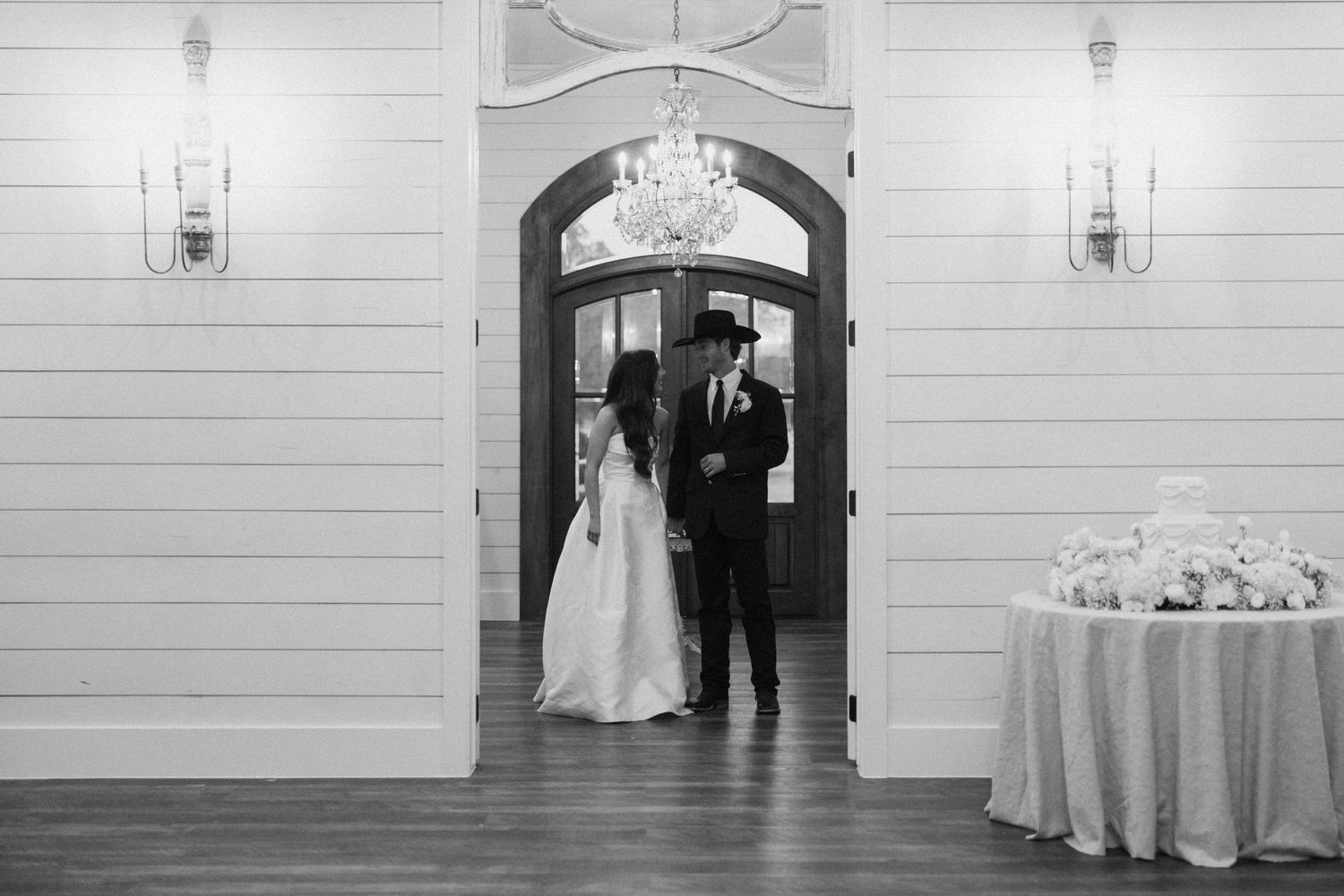 Black and white wedding photos arranged in a horizontal sequence showing ceremony and reception moments at a chapel venue.