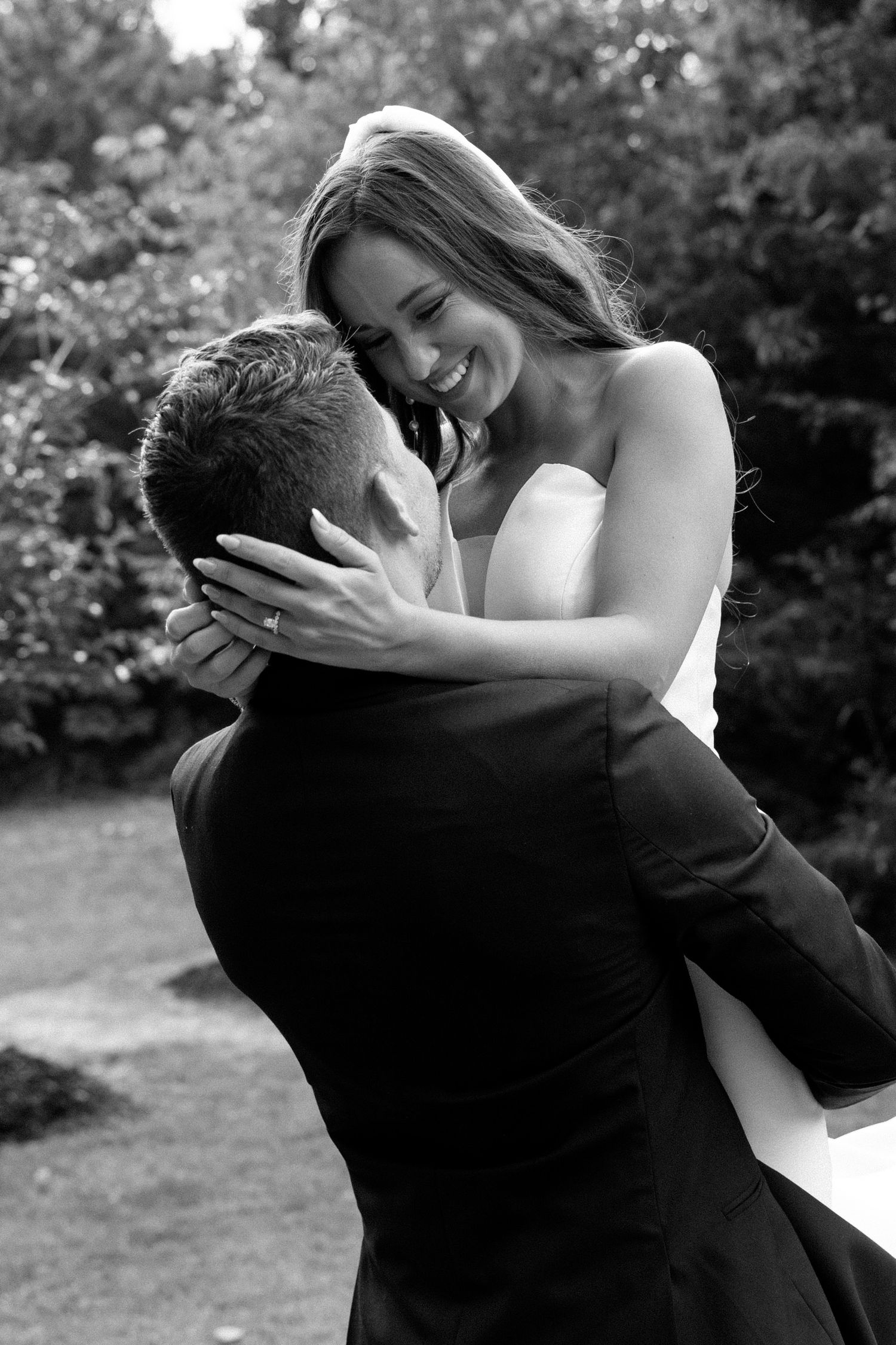 A romantic black and white photo sequence shows a couple embracing and dancing together outdoors.