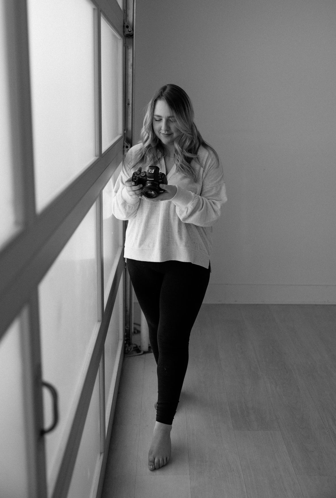 Black and white artistic portrait series showing movement and emotion in a minimalist hallway setting.